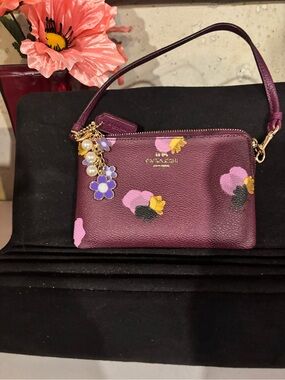 Coach Plum Floral Leather Wristlet with Charm new condition